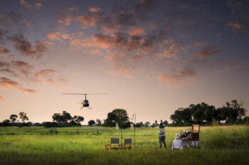 Helicopter arrival at remote safari camp in Botswana