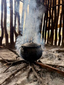 Traditional cooking over an open fire in a rural Botswana village