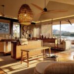 Artists renders of guest lounge and library at Musesenji River Camp