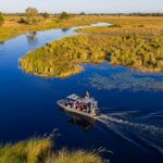 a motorboat cruising through the okavango waters around Mokolwane Plains